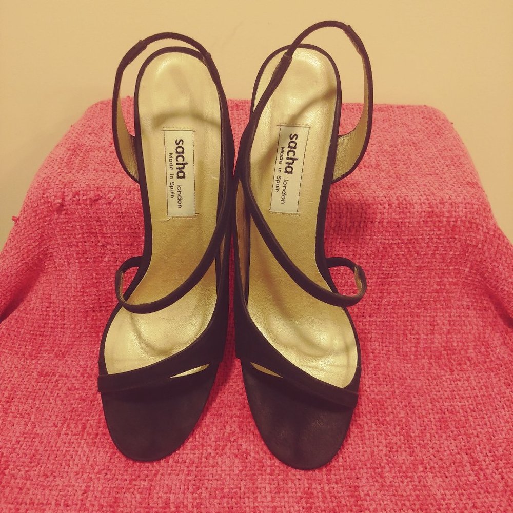 Parade your pedicure in these sexy, strappy suede designer sandals!